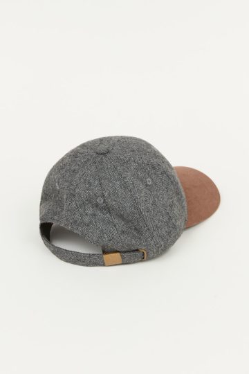 Bi-material herringbone patterned cap